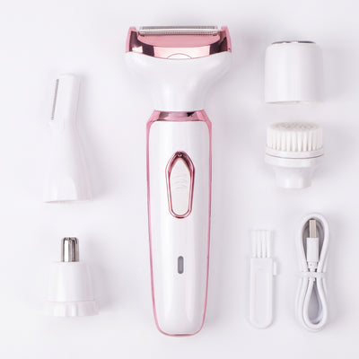 Trimmerkit liggande med fyra utbytbara huvuden och kabel