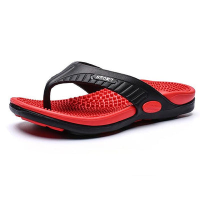 Röda flip flops med svart rem och noppig fotbädd