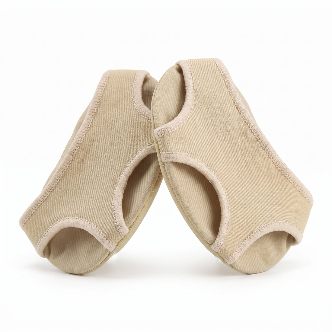 Pair of beige gel forefoot cushion pads on white background