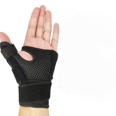 Sort håndledsbandage set fra håndfladen, der viser velcrorem