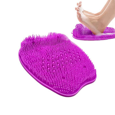 Bare feet washing on purple shower scrubber mat