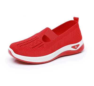 Röd andningsbar slip-on-promenadsko, från sidan