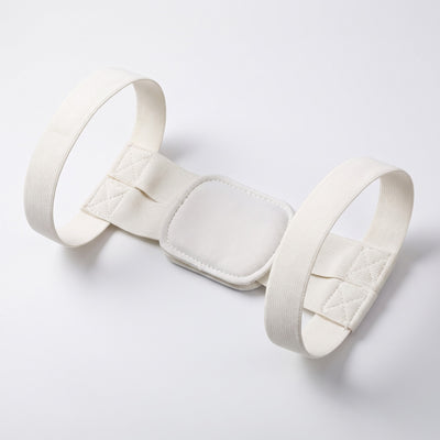 Hvid holdningsbandage flat lay på hvid baggrund