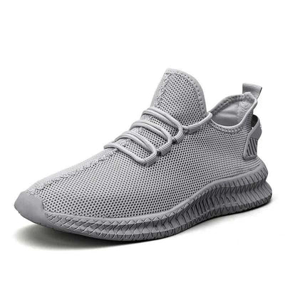 Gråa sneakers med elastisk snörning och luftig ovandel