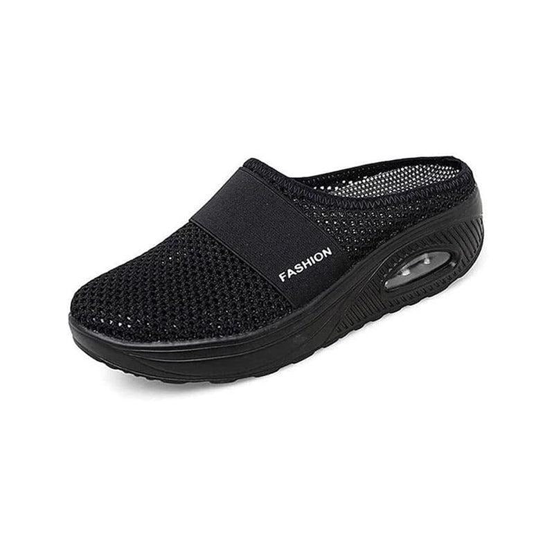 Svart stötdämpande slip-on-toffel med luftsula