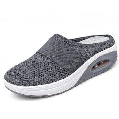 Grå stötdämpande slip-on-toffel med luftsula